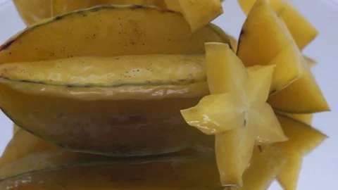 Star fruit on white background rotating Stock Footage 124693551