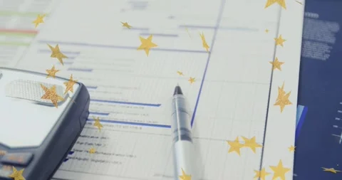 Star overlay appearing, camera panning left showing calculator and pen on Stock Footage 333965390