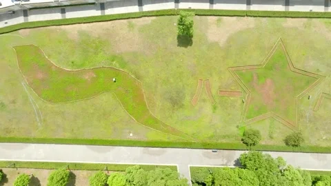 Star-shaped planting pattern in a memorial lawn at Bayi Square Stock Footage 348144955
