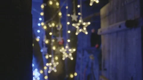 Star-Shaped String Lights Create Warm Ambience in Dimly Lit Beijing Bar Interior Stock Footage 345750530