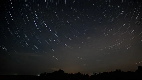 Star trails in the night sky Stock Footage 140177172