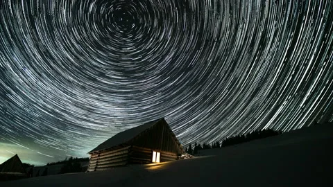 Star trails in the night sky Stock Footage 141857741