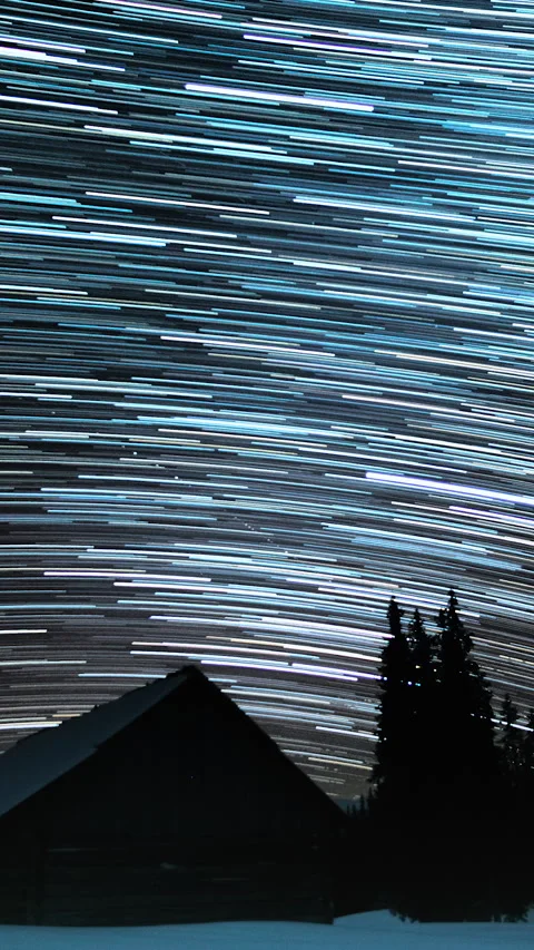 Star trails in the night sky Stock Footage 265168292