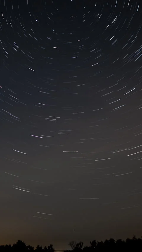 Star trails in the night sky Stock Footage 269335740