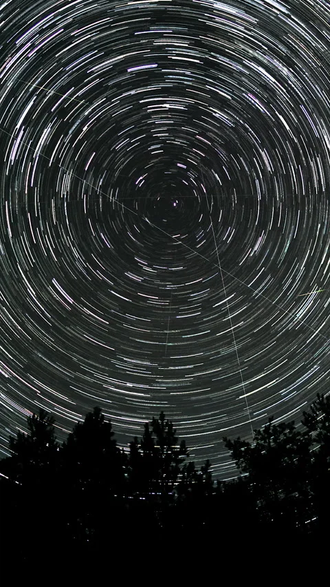Star trails in the night sky Stock Footage 276909493