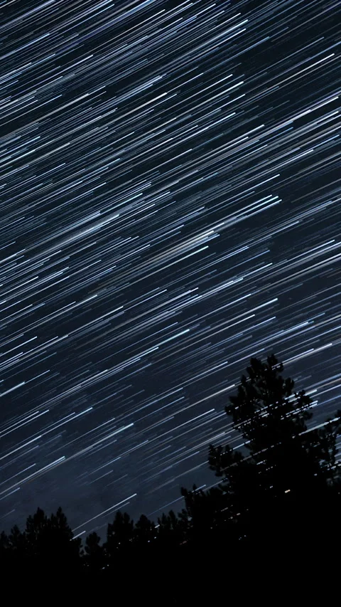 Star trails in the night sky Stock Footage 276909731