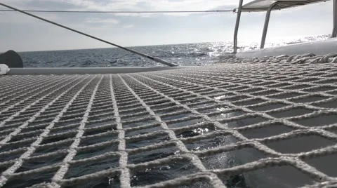 Starboard hull of catamaran cuts through waves as they crash into bow Video stock 67863770