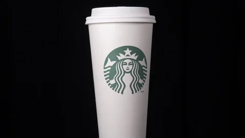 Starbucks coffee cup rotating  medium shot 4k Stock Footage 108186050
