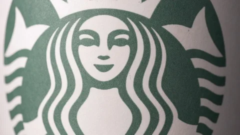 Starbucks coffee cup rotating  medium ECU shot 4k Stock Footage 108190584