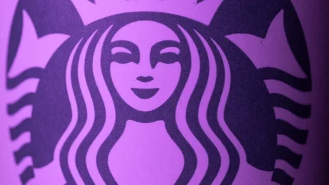 Starbucks coffee cup rotating in styled purple light ECU shot 4k Stock Footage 108187682