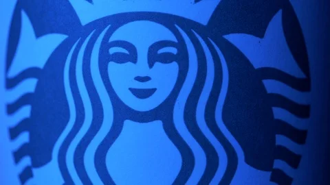 Starbucks coffee cup rotating in styled blue light ECU shot 4k Stock Footage 108190346