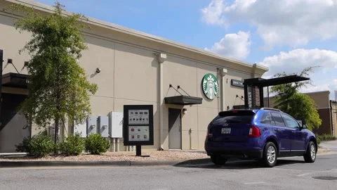 Starbucks coffee restaurant drive thru back view Video stock 167776141
