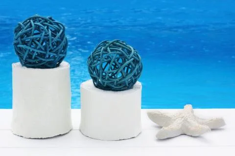 Starfish with pedig balls on white wooden stand on white jetty / peir with sea / Stock Photos
