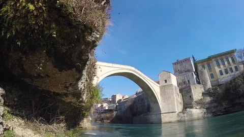 Stari Most (Old Bridge) is a rebuilt 16th-century Ottoman bridge in Mostar Stock Footage 87971697