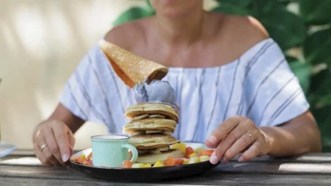 Staring at a stack of ice cream pancakes. Stock Footage 269514727