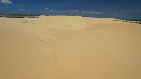 Stark geographical contrast between sand and water near Mui Ne, Vietnam Stock Footage 240681858