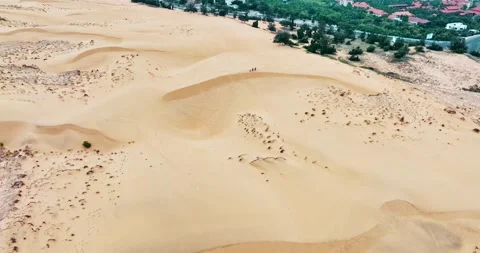 Stark geographical contrast between sand and water near Mui Ne, Vietnam Stock Footage 296720979