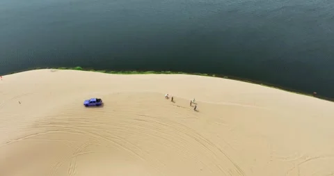 Stark geographical contrast between sand and water near Mui Ne, Vietnam Stock Footage 296721902