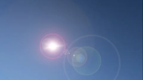 The stark sun moving across a clear sky Stock Footage 220518324
