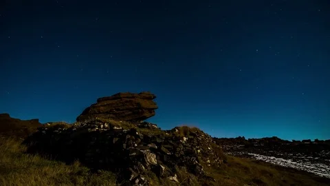 Starry blue sky spread over the house made from rocks Stock Footage 73010956