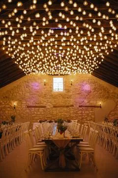 Starry ceiling. multiple light bulbs on a party setting Stock Photos