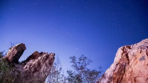 Starry night with moon light on the rocks Stock Photos