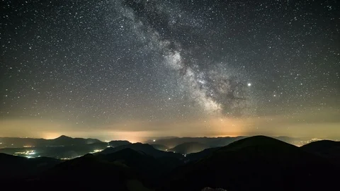 Starry night in mountains Time lapse Milky way galaxy stars countryside traffic Stock Footage 112051135