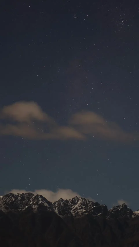 Starry Night Over Snowy Mountain Range Vídeo Stock 310073294