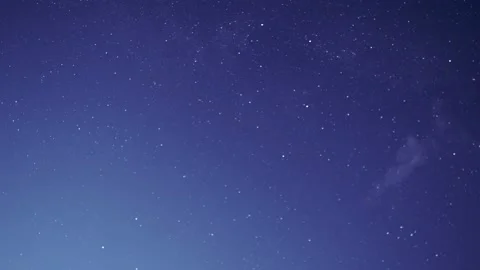 Starry night sky with approaching clouds. Shooting stars. Stock Footage 232263544