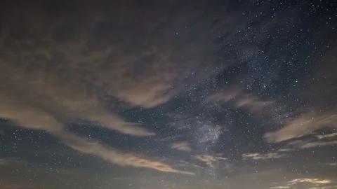 Starry night sky with clouds and stars of milky way galaxy in summer Time lapse Stock Footage 116159341
