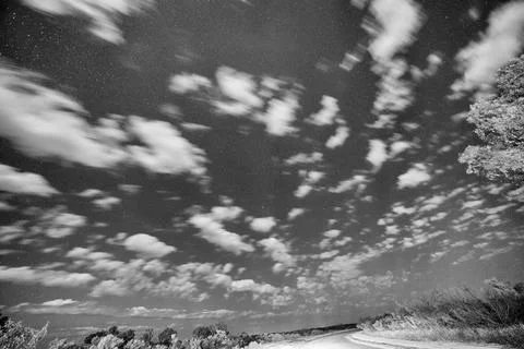 Starry night sky with clouds over Western Australias remote outback landsca.. Fotos Stock
