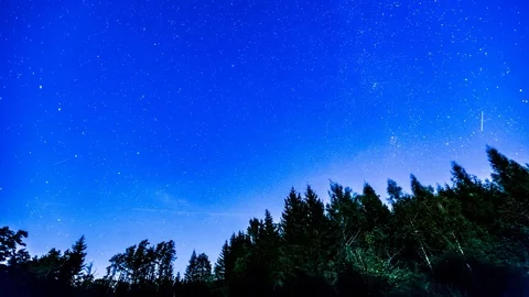 Starry night sky with light of setting moon 4k timelapse. Stock Footage 80171235