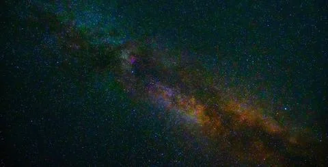 Starry night sky with stars, galaxies and bright multicolored milky way Stock Photos
