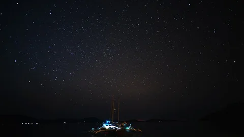Starry night timelapse in Palawan with trimaran sailboat Philippines Stock Footage 124997456