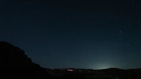 Starry Sky Above Red Rock Canyon and Freeway Traffic 8K Time Lapse Vídeo Stock 296420605