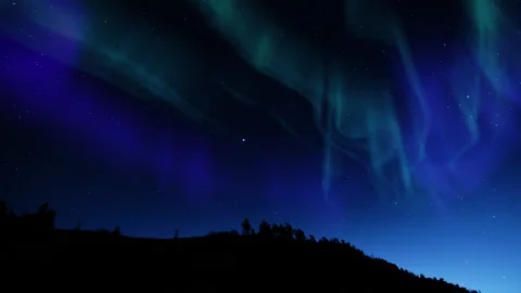 Starry Sky Aurora Nighttime Symphony Above Mountain Forest Loop Stock Footage 340985417