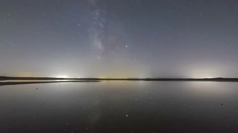 Starry sky with bright moon over calm river Video stock 232663899