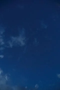 Starry sky with clouds. Summer twilight. Stock Photos