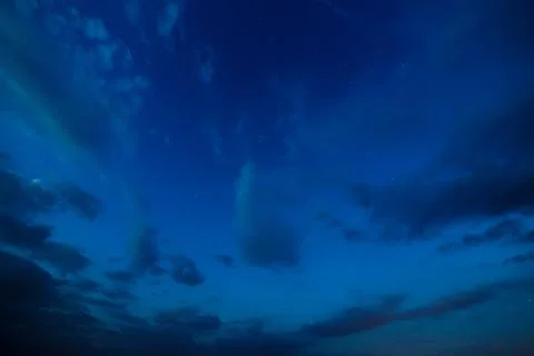 Starry sky with clouds. Summer twilight. Stock Photos