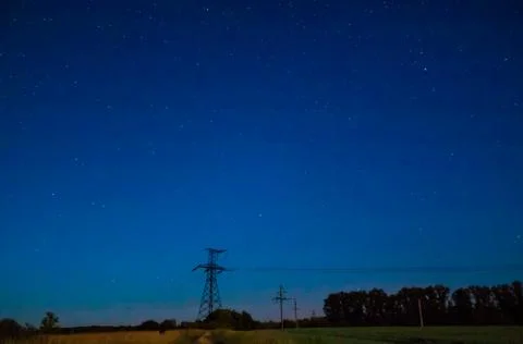 Starry sky in the field. Stock Photos