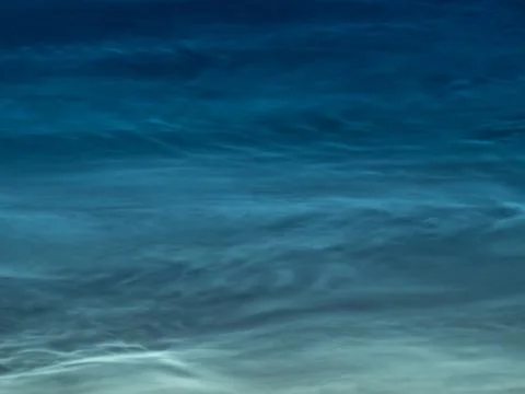 Starry sky with noctilucent clouds at summer solstice night. Fantastic clouds Stock Photos