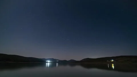 Starry sky over a mountain lake, 4k Timelapse Stock Footage 273495175