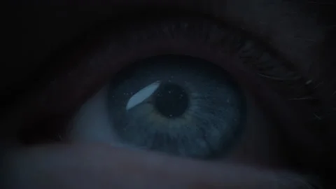 Starry sky reflected in a blue eye Stock Footage 239797879