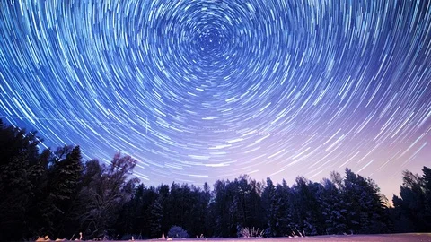 Starry sky revolves around the polar star. Leave traces in the form of fading Video stock 103351704