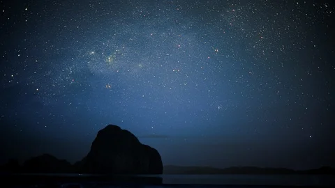 Starry sky with shooting stars and silhouette of island in Palawan Stock Footage