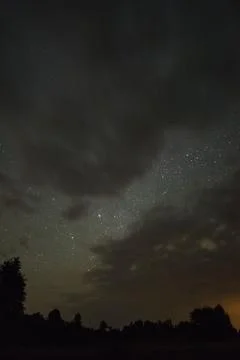 Starry sky through the clouds Stock Photos