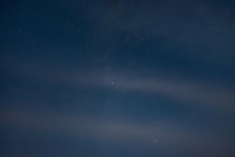Starry sky through the clouds Stock Photos