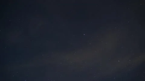 Starry sky through the clouds, time lapse Stock Footage 137560228
