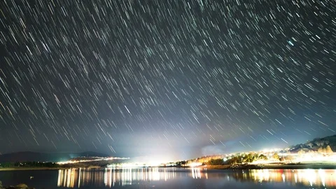 Starry star trail timelapse over Lake Jindabyne looking towards Jindabyne Video stock 114009490