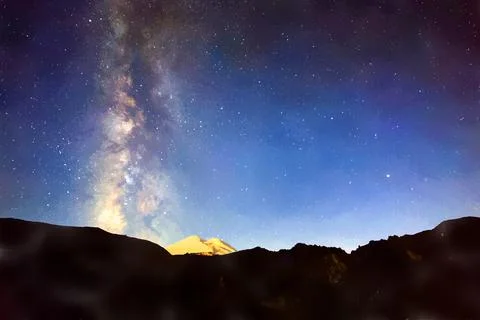 Stars and clouds over Mount Elbrus. Watercolor illustration. Night landscape. イラスト素材